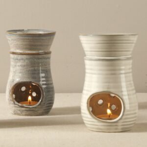 Handmade grey and white ceramic incense stove with speckled glaze for essential oil warming