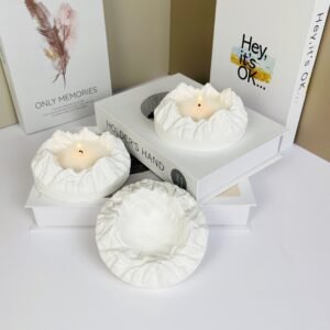 Size comparison of the sculptural plaster mountain tray for aromatherapy styling.