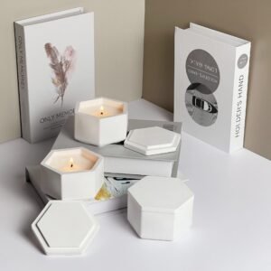 Close-up detail of textured plaster finish on geometric candle container