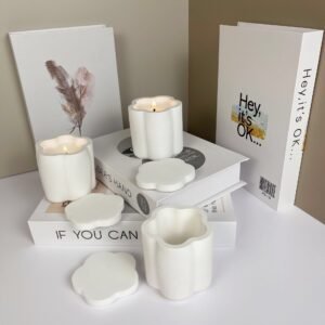 Artistic floral embossed plaster candle container with plum flower pattern