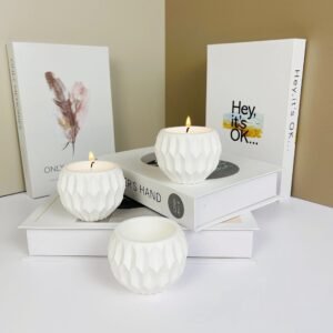 Detailed view of handcrafted diamond pattern on plaster candle jar surface