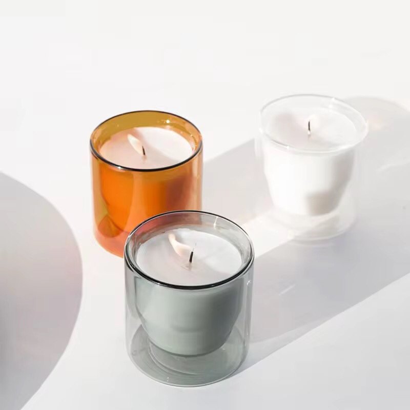 Crystal clear borosilicate glass candle holder revealing intricate double-wall construction and smooth polished rim.