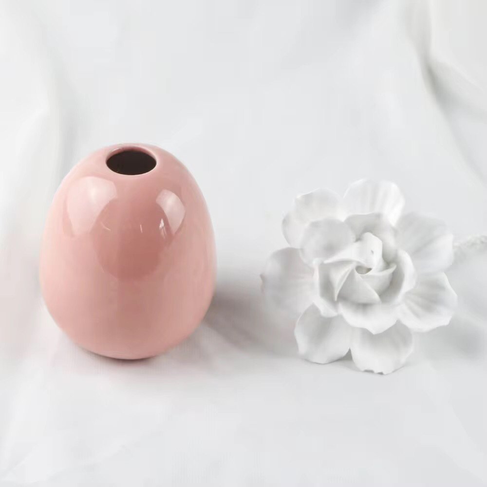 European ceramic aroma bottle in pastel pink, featuring wide base stability and delicate