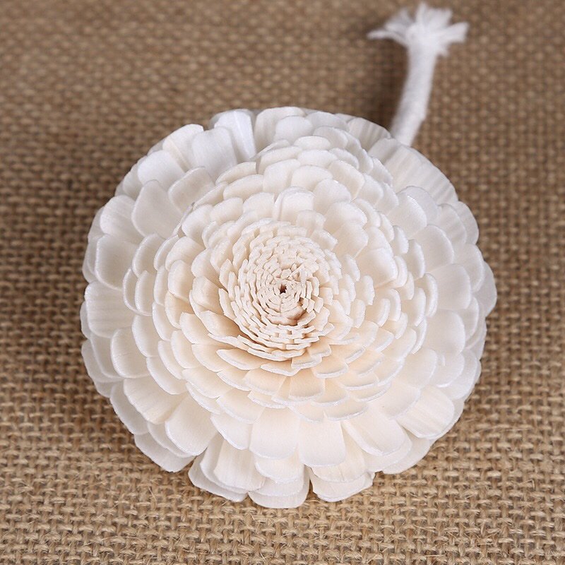 Miniature feverfew decorative topper showcasing minimalist floral design aesthetic