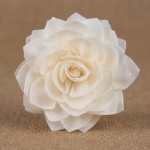 Close-up of white handmade dahlia dried flower showing delicate petal details and natural vine stem attachment