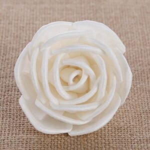 Macro detail of curled petal edges on white paper rose showcasing handcrafted texture and quality craftsmanship