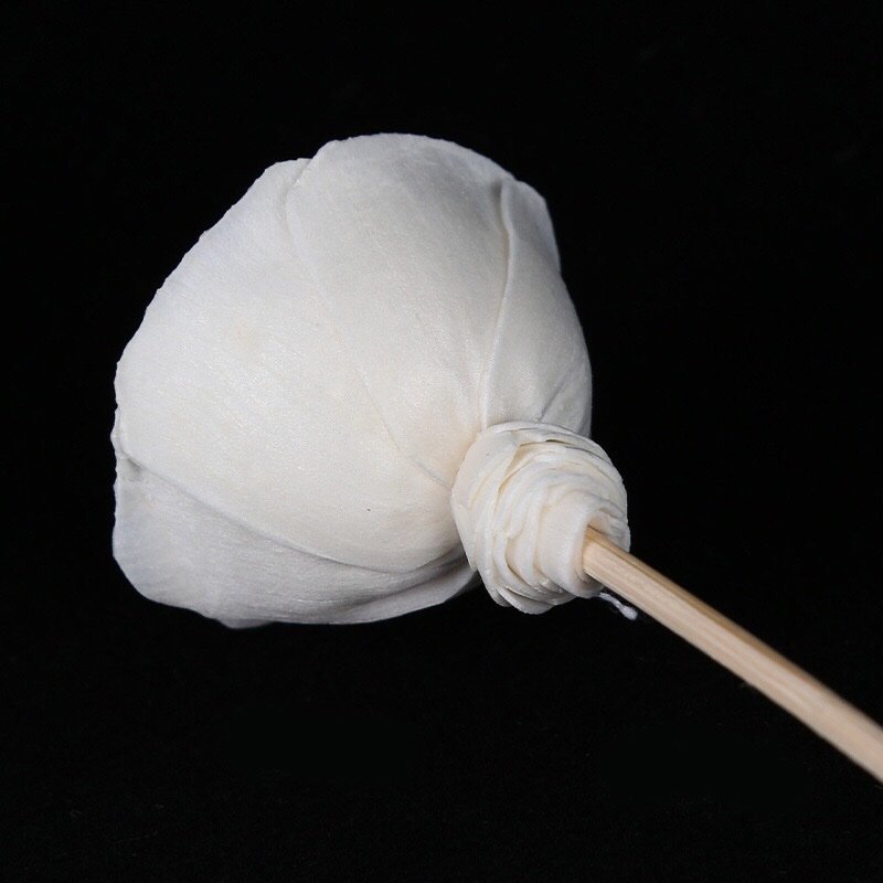 Side view of miniature white paper rose, displaying dimensional form and dual mounting options (pre-drilled hole and natural stem).
