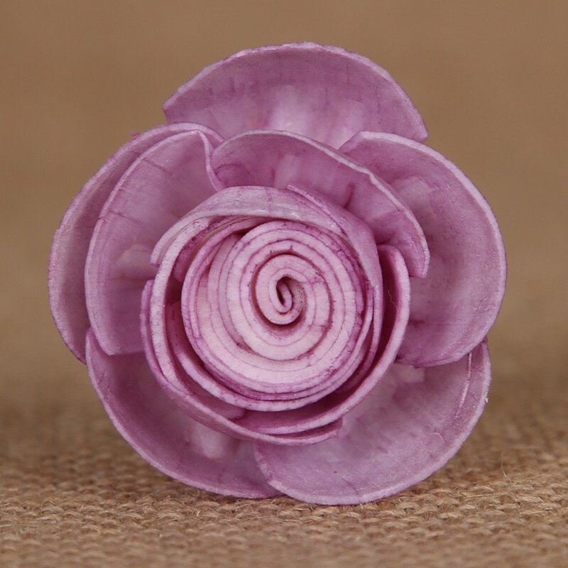 Royal purple dried rose close-up displaying rich color depth and flexible attachment options for craft projects