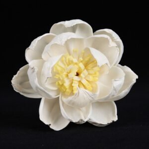 Close-up side view of handmade peony bloom highlighting dimensional form and delicate yellow center details