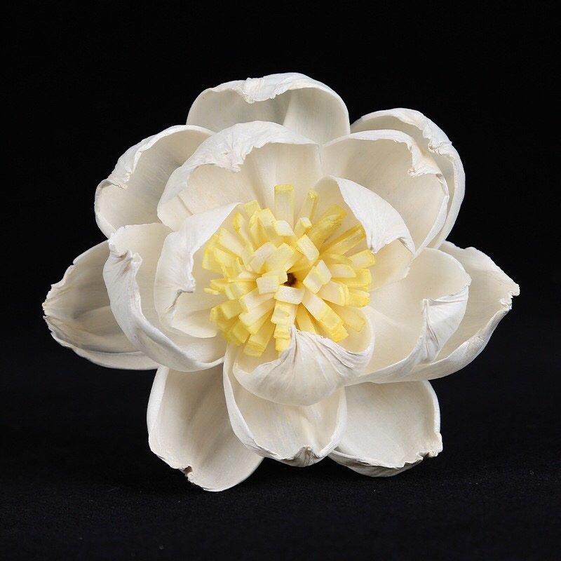 Close-up side view of handmade peony bloom highlighting dimensional form and delicate yellow center details