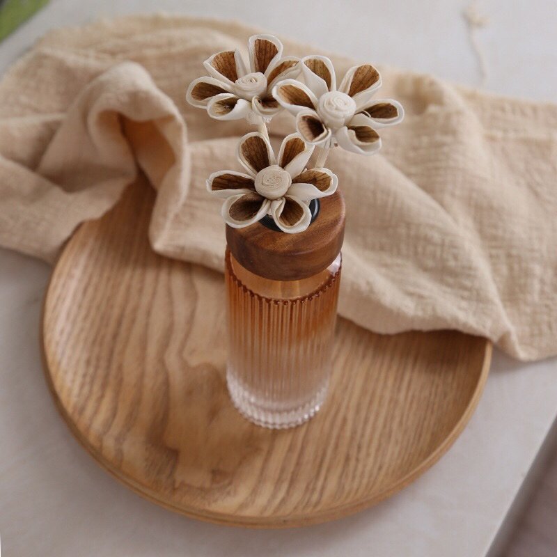 Close-up side view of two-tone fragrance flower highlighting dimensional layers and mounting flexibility