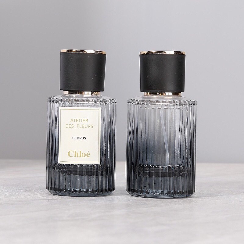 Minimalist Black Perfume Bottle with Ribbed Texture - Premium Fragrance Packaging