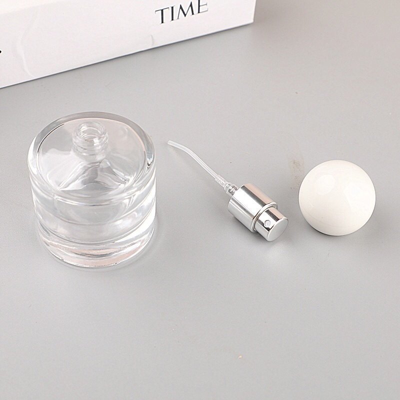 Elegant Transparent Perfume Bottle with Light-Colored Cap - Clean Aesthetic Packaging
