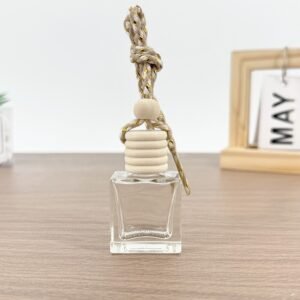 Close-up of the geometric edges and transparent quality of the square glass bottle.