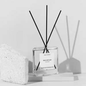 The bottle styled on a minimalist shelf with dried botanicals and linen, highlighting its neutral aesthetic.