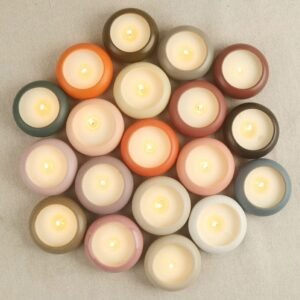 Stacked ceramic candle jars in multiple colors with lit candles – top view showing layered 1-3 tier designs for home decor and candle making