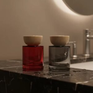 Red and gray reed diffusers in a home setting – on a shelf or table, decorative use with reeds