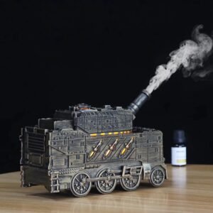 Bronze train aromatherapy diffuser emitting mist with warm LED light – side view showing locomotive shape, chimney, and wheels