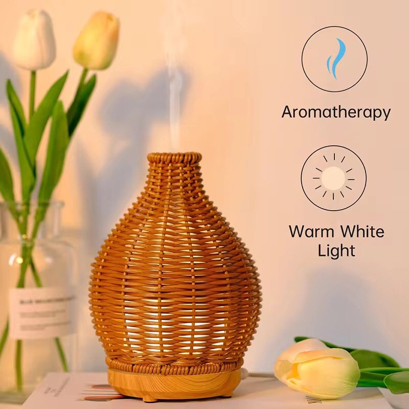 Side view of rattan aromatherapy diffuser with mist output – showing detailed woven pattern and warm earthy tone