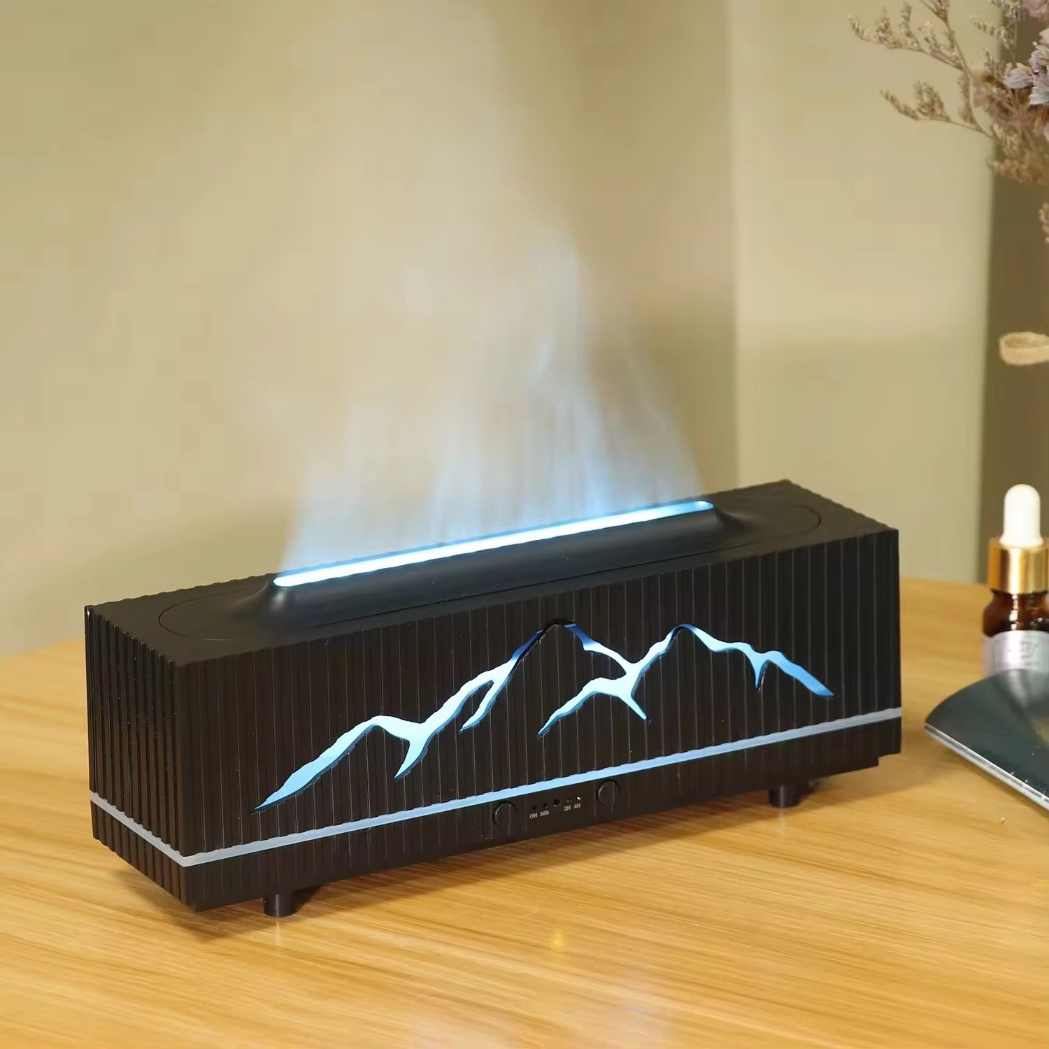 Black flame aromatherapy diffuser emitting mist with orange flame light – dark background, dramatic and relaxing mood