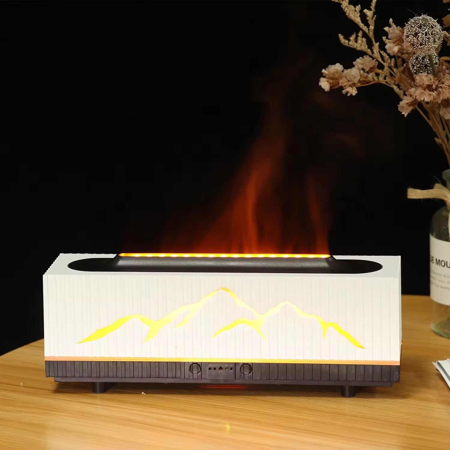 White flame aromatherapy diffuser with realistic flickering LED flame effect and rising mist – on a bedside table, cozy home ambiance
