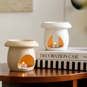 White and beige mushroom wax melt burners placed side by side – color comparison, both same size and shape