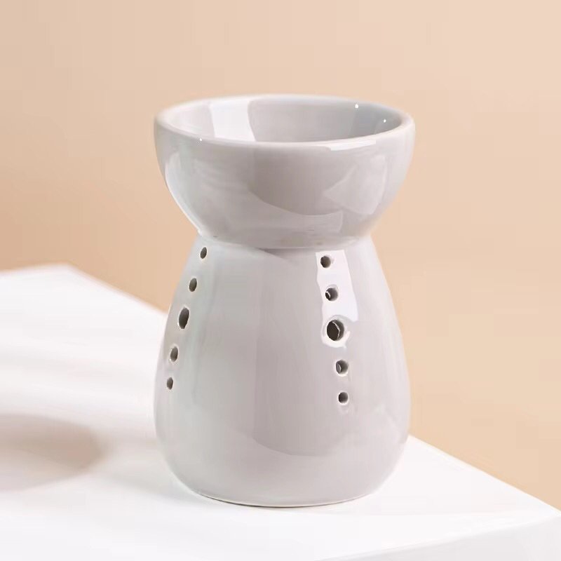 Gray vintage wax melt burner standing alone – soft neutral tone, rustic home decor style