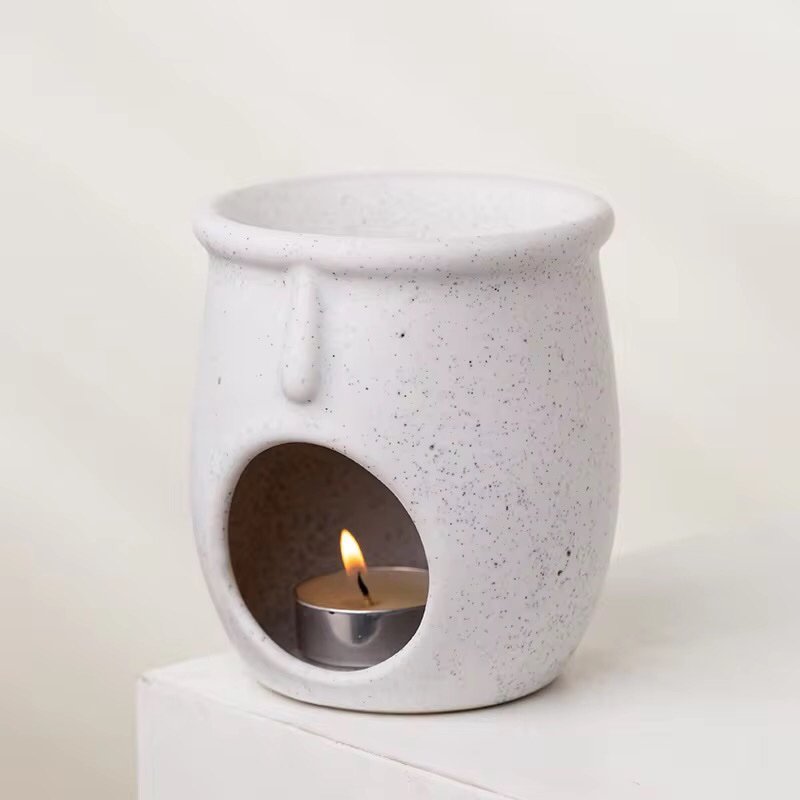 White ceramic wax melt burner with artistic sculptural form – matte finish, minimalist home decor piece