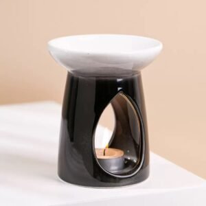 Close-up of black burner with white dish – smooth glaze, clean lines, cutout detail
