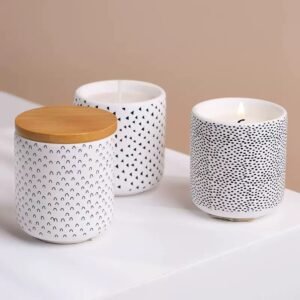 Three white ceramic jars showing three dot patterns – speckle, triangle, and strawberry seed – arranged together