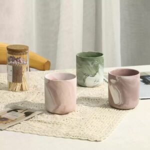 Three ink‑wash jars shown from a slight angle – highlighting organic glaze movement and unique surfaces
