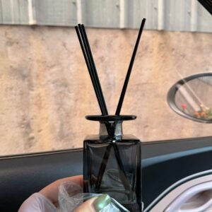 Close‑up of 150ml transparent black aromatherapy bottle – sleek dark glass, smooth finish, minimalist design